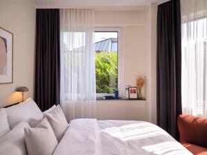 Postel nebo postele na pokoji v ubytování STAYERY Cologne Sülz