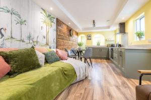 a living room with a couch and a kitchen at Boutique Homes At 4 in Bangor