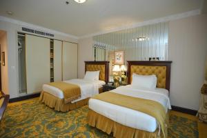 Postel nebo postele na pokoji v ubytování Habitat Hotel All Suites - Jeddah