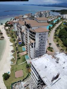 an aerial view of a building on the beach at Elegant 5-Bedroom Apartment in Exclusive Playa Escondida Pet Friendly in María Chiquita