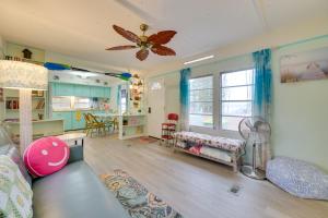 a childrens room with a couch and a table at Walk to Manistee Lake Retro Cottage with Fire Pit! in Kalkaska +23 photos