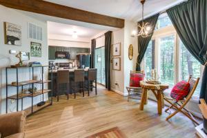 a living room with a kitchen and a dining room at Wintergreen Resort Condo with Deck, 0 3 Mi to Slopes in Lyndhurst