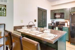 a kitchen with a large island with a counter top at Wintergreen Resort Condo with Deck, 0 3 Mi to Slopes in Lyndhurst