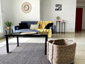 Posezení v ubytování Appartement Le Nid de Coco