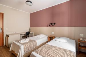 Postel nebo postele na pokoji v ubytování Hotel Cisne