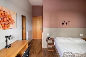 Postel nebo postele na pokoji v ubytování Hotel Cisne