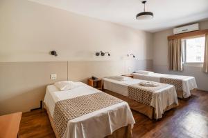 Postel nebo postele na pokoji v ubytování Hotel Cisne