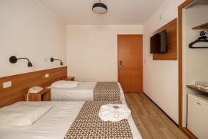 Postel nebo postele na pokoji v ubytování Hotel Cisne