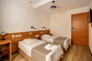 Postel nebo postele na pokoji v ubytování Hotel Cisne