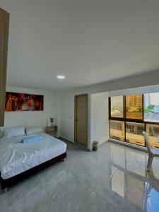 Postel nebo postele na pokoji v ubytování Hotel La Estrella de David Cartagena