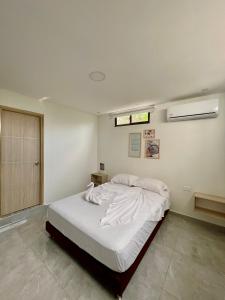 Postel nebo postele na pokoji v ubytování Hotel La Estrella de David Cartagena