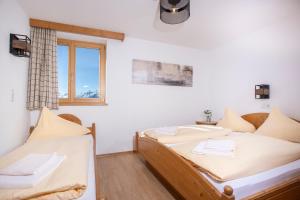 Voodi või voodid majutusasutuse Alpenrelax Krepperhütte toas