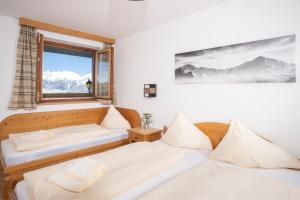 Voodi või voodid majutusasutuse Alpenrelax Krepperhütte toas