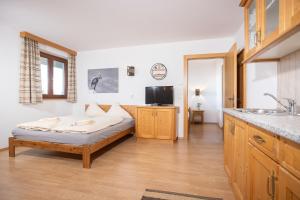 Voodi või voodid majutusasutuse Alpenrelax Krepperhütte toas