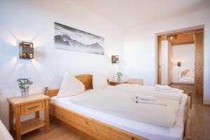 Voodi või voodid majutusasutuse Alpenrelax Krepperhütte toas