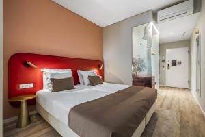 Postel nebo postele na pokoji v ubytování King David Suites by Homie