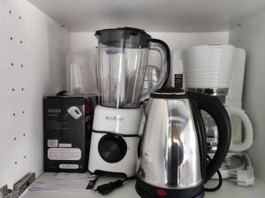 a kitchen counter with a blender and other appliances at Mrežnica - Zelena oaza II in Generalski Stol