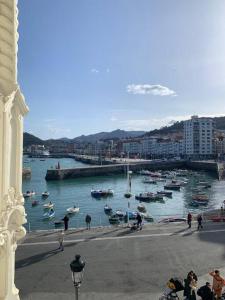 a group of boats in the water in a harbor at Luminoso piso con vistas al Puerto in Castro-Urdiales