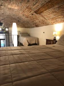 A bed or beds in a room at Casa Vacanze Piazza Vecchia