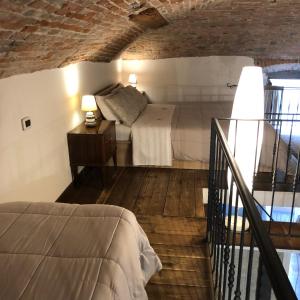A bed or beds in a room at Casa Vacanze Piazza Vecchia