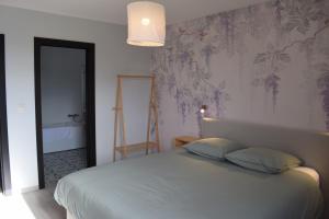 Postel nebo postele na pokoji v ubytování L'Oasis d'Yza