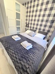 Łóżko lub łóżka w pokoju w obiekcie Lucky40 - Apartament z widokiem na morze, SPA gratis, Dwie Sosny