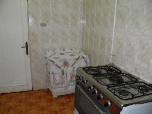 a kitchen with a stove top oven in a room at لؤلؤه الفيروز in Marsa Matruh +7 photos