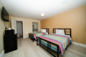 Postelja oz. postelje v sobi nastanitve Sinbad Motel