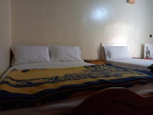 Letto o letti in una camera di gîte d'étape ziz oasis