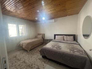 a bedroom with a bed and a window at HAPPY HOUSE 1 Pamukkale in Pamukkale +24 photos