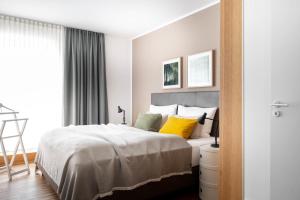 Ένα ή περισσότερα κρεβάτια σε δωμάτιο στο BodenseeApartment Suite