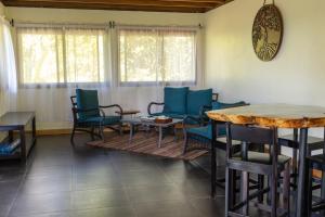 a room with chairs and a table and a table and chairs at Cascadas Corcovado - luxury villa in Charcos +31 photos