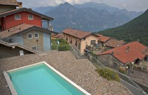 a swimming pool sitting on top of a house at Casa Rita Fonteno in Fonteno