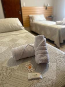 Postel nebo postele na pokoji v ubytování Hotel Punta Lavalle