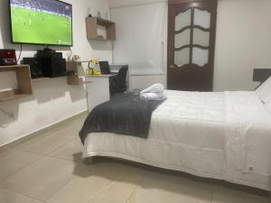 Katil atau katil-katil dalam bilik di Casa Hostal los Profes