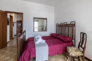 Postel nebo postele na pokoji v ubytování Casa Iblea