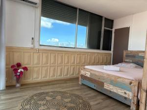 Voodi või voodid majutusasutuse PENTHOUSE 10 MIN port croisière et aéroport toas