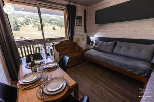 Et opholdsområde på Résidence Le Bois D'aurouze - Joli studio rénové au pied des pistes MAE-7784