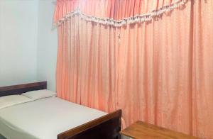 Ένα ή περισσότερα κρεβάτια σε δωμάτιο στο Grand Refuge Holiday Rooms