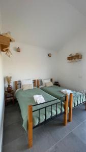 a bedroom with two beds in a room at Monte Ti Bento in Mourão +20 photos