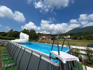 a swimming pool with a slide on a balcony at Kurt e famiglia in Casalzuigno