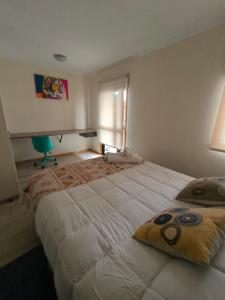 Postel nebo postele na pokoji v ubytování APART HOTEL EN BULNES