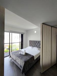 Voodi või voodid majutusasutuse Hermoso Loft en el mejor sector de la ciudad toas +31 fotot