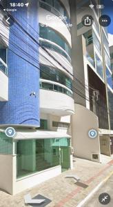 a building with a bird on the side of it at Apartamento para alugar na temporada a 150m do mar in Itapema