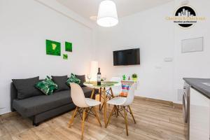 Una televisión o centro de entretenimiento en Apartamento El Nido