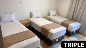 Letto o letti in una camera di Hotel Mega