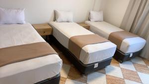 Letto o letti in una camera di Hotel Mega