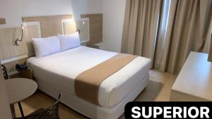 Letto o letti in una camera di Hotel Mega
