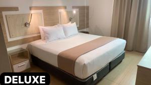 Letto o letti in una camera di Hotel Mega