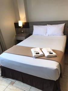 Letto o letti in una camera di Hotel Mega